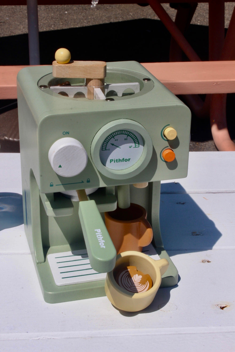 A toy espresso machine at the Mandala stand