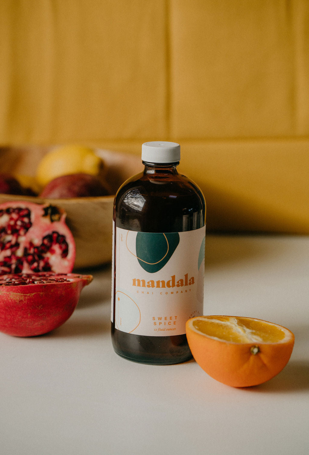 Sweet Spice chai bottle with pomegranate and orange