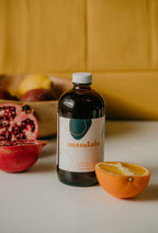 Sweet Spice chai bottle with pomegranate and orange