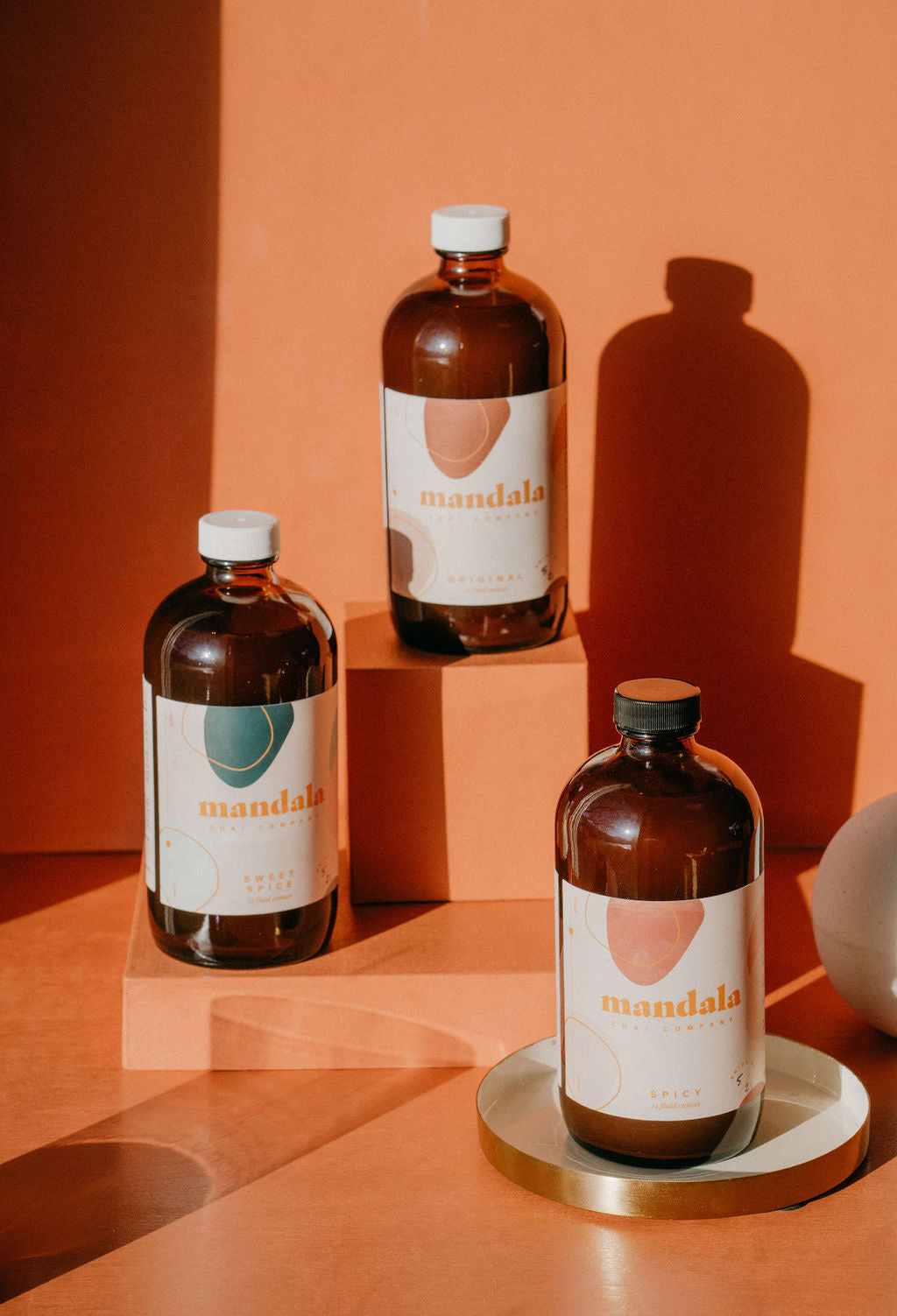 Sweet Spice, Original and Spicy chai concentrates in amber glass bottles